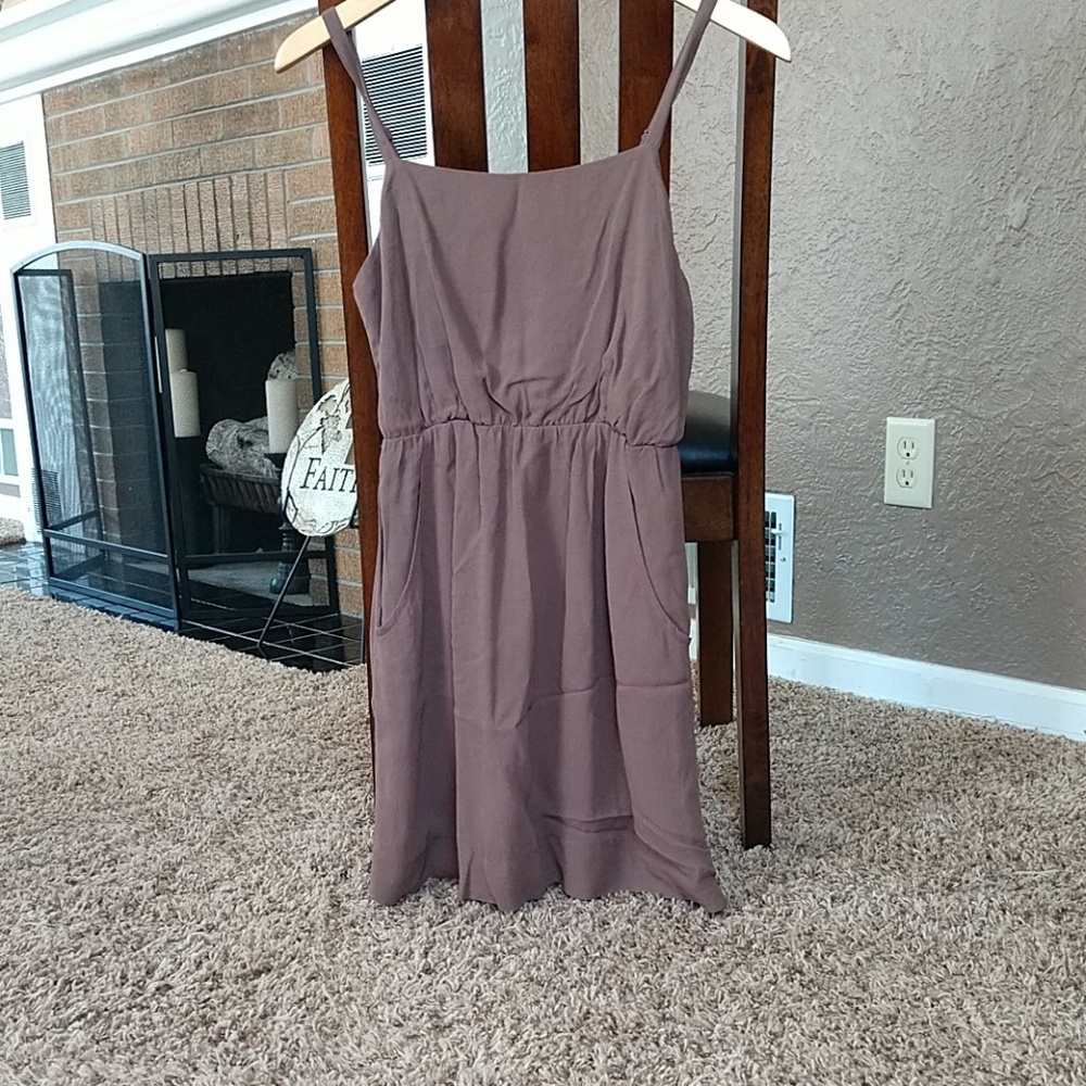 Brown dress with semi open back design.